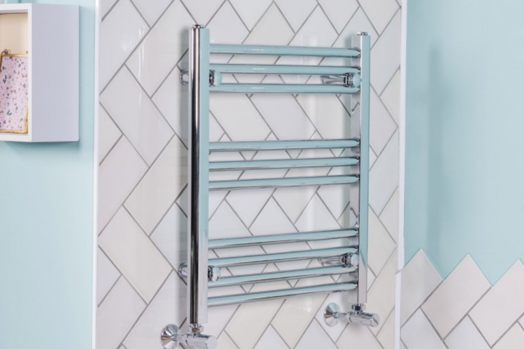 Heated Towel Rail Mounted Against Tiled Wall