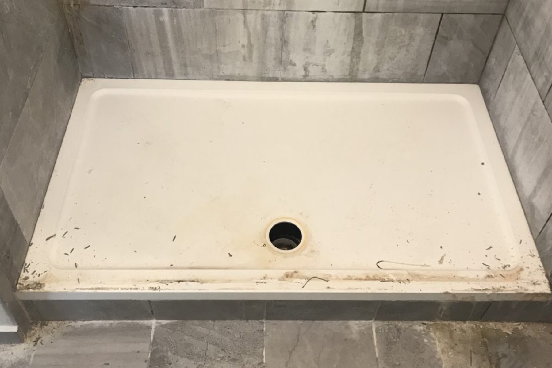 Rusting Shower Tray Before Getting Clean In Shower Room