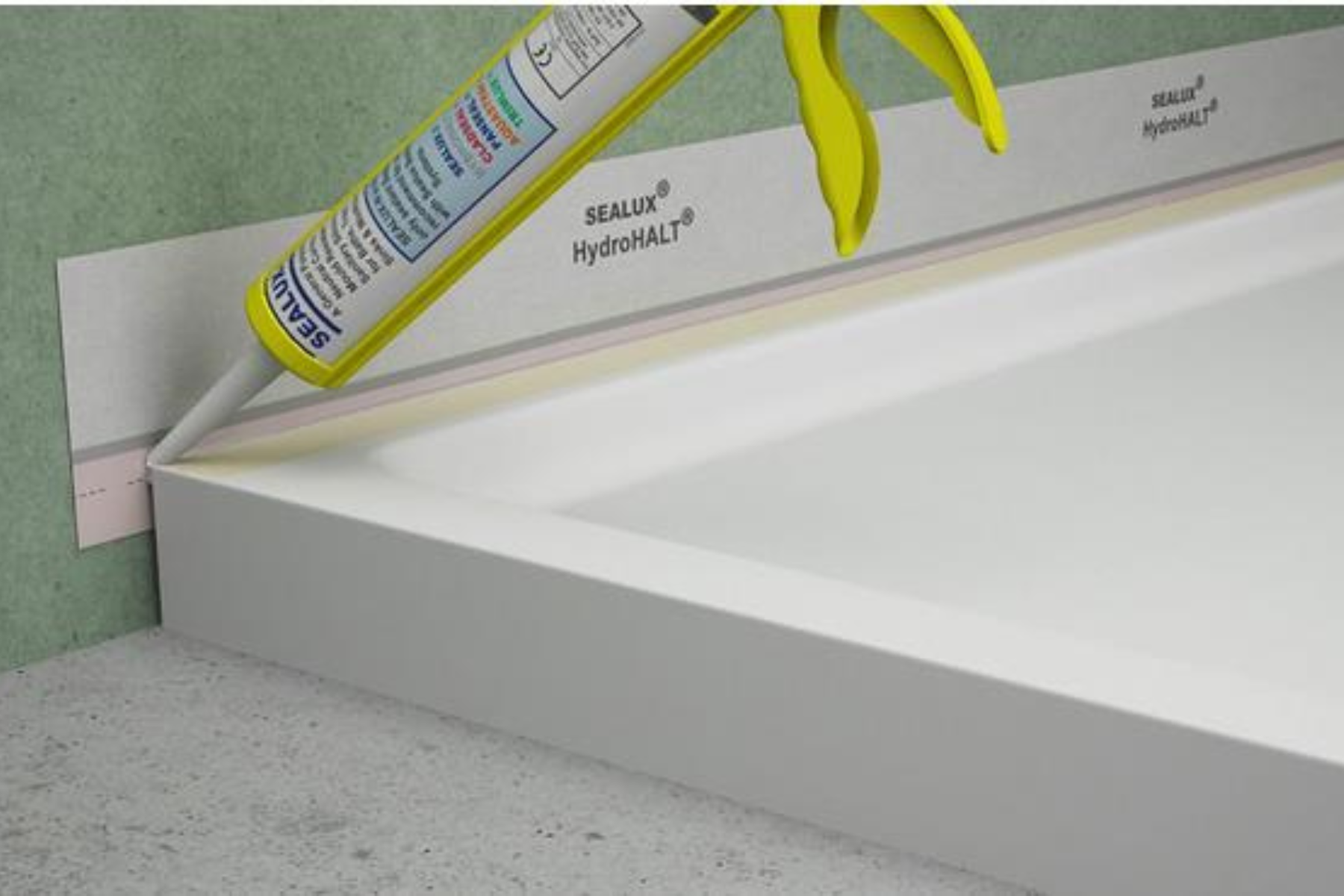 Sealant Getting Placed Around Shower Tray In Bathroom