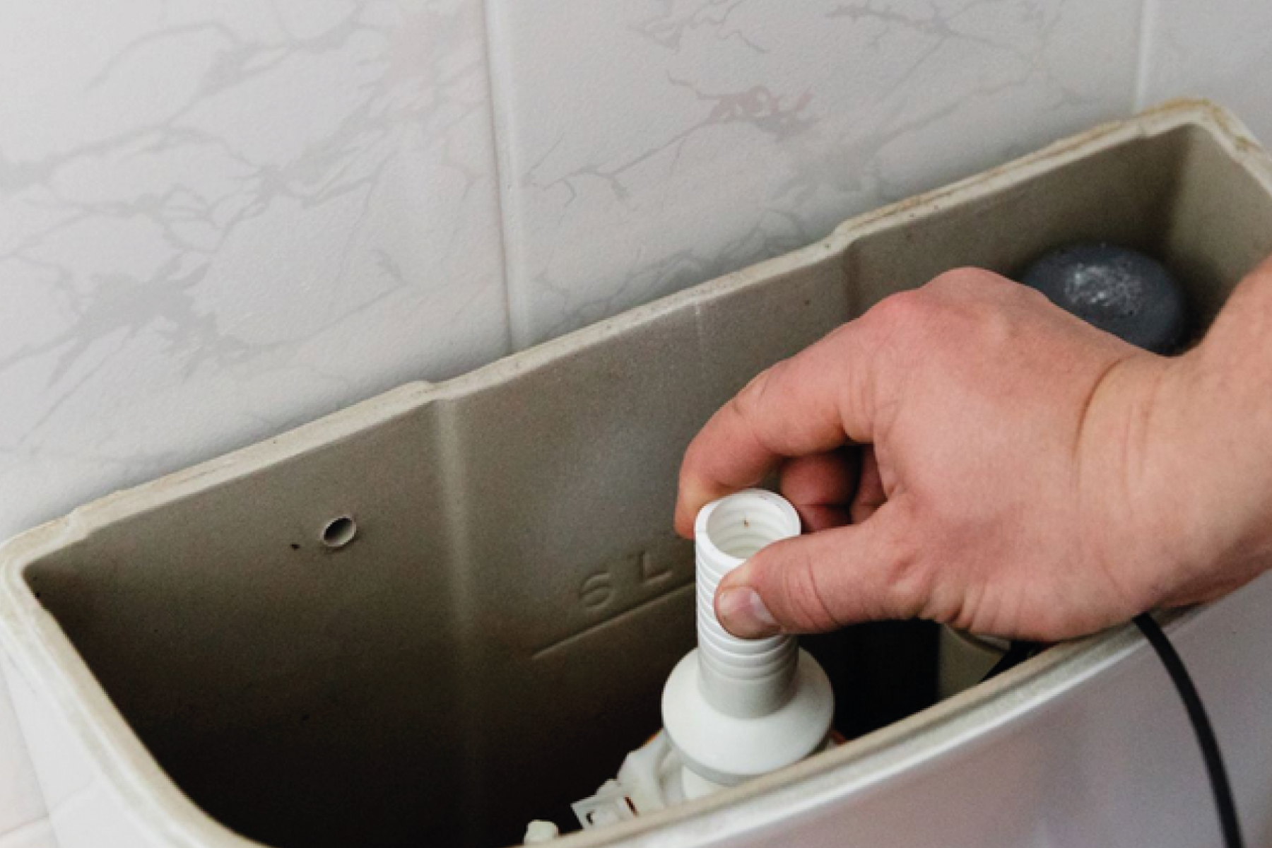 Plumber Testing and Fixing Cistern Toilet
